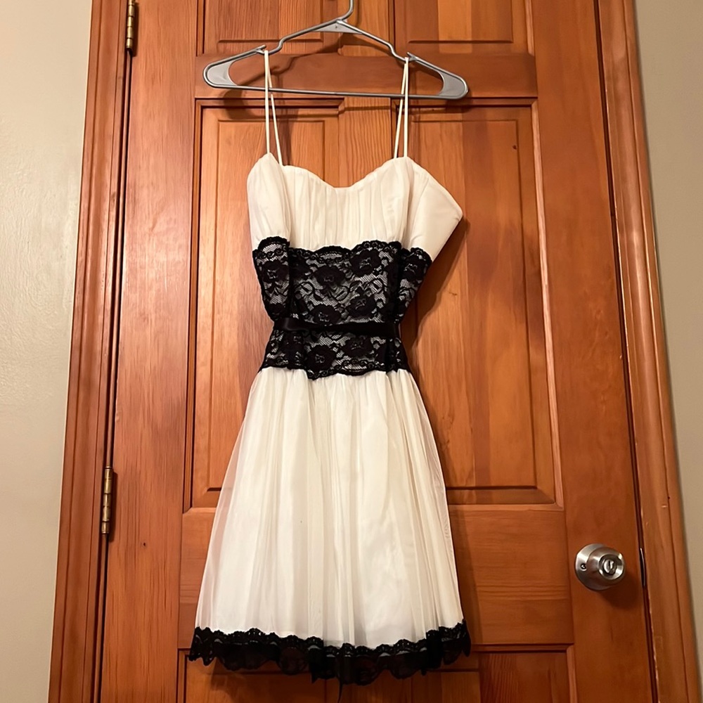 White Mini dress with black lace mid section and black lace bottom trim